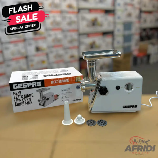 A white electric meat grinder with various attachments and its packaging.