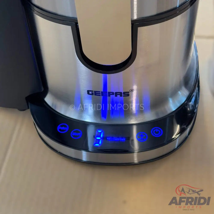 A stainless steel electric kettle with a digital display and control buttons.