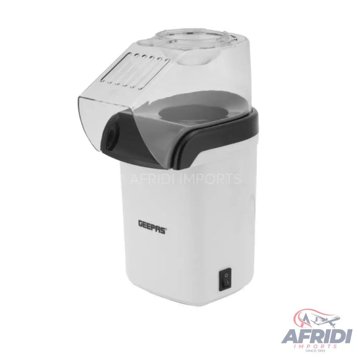 White and black automatic popcorn maker.