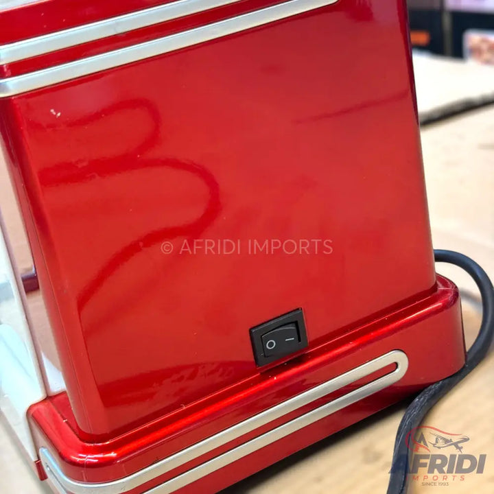 Red small appliance with a power switch and silver trim.