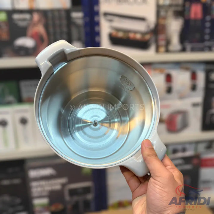A stainless steel inner pot with a light-colored handle, likely for an electric cooking appliance.