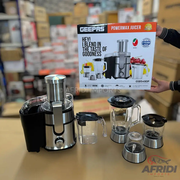 A Geepas Powermax juicer and blender set, including a juicer, blender, and grinder attachments.