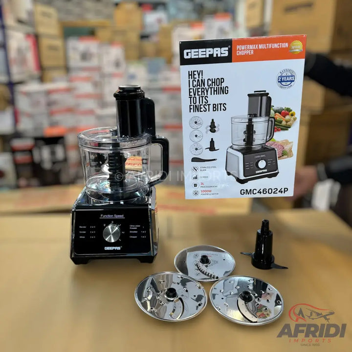 Black and clear multi-function food chopper with various blade attachments.