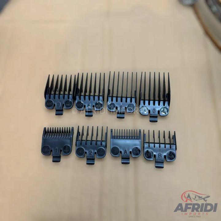 A set of eight black hair clipper guide combs with varying lengths.