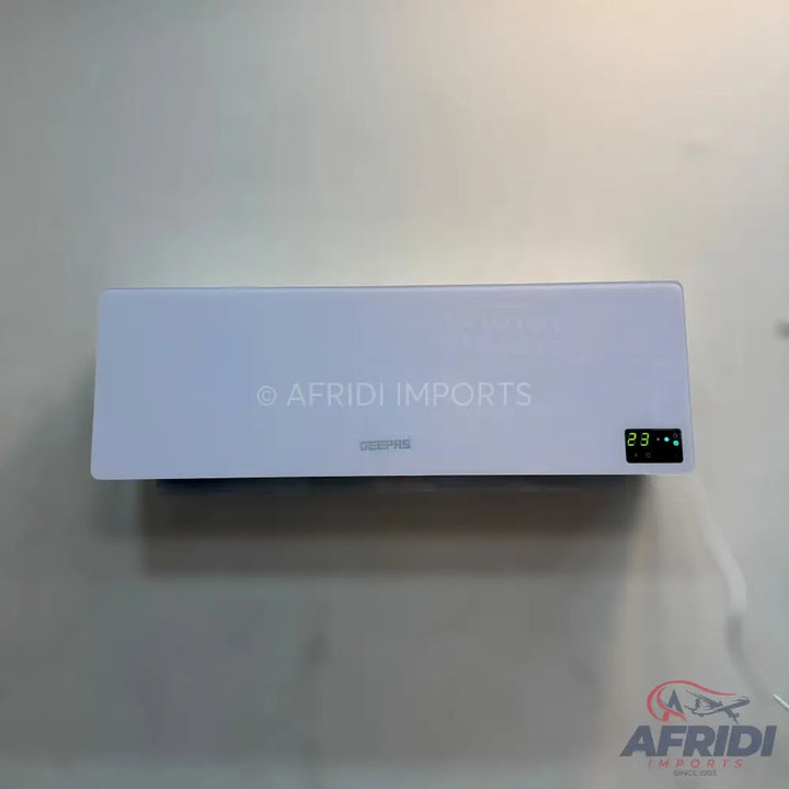 White wall-mounted air conditioner with a digital display showing ’23’’.