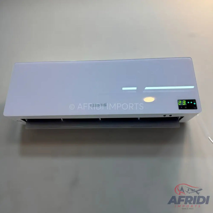 White wall-mounted air conditioner with a digital display.