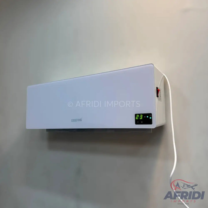 White wall-mounted air conditioner with a digital display.