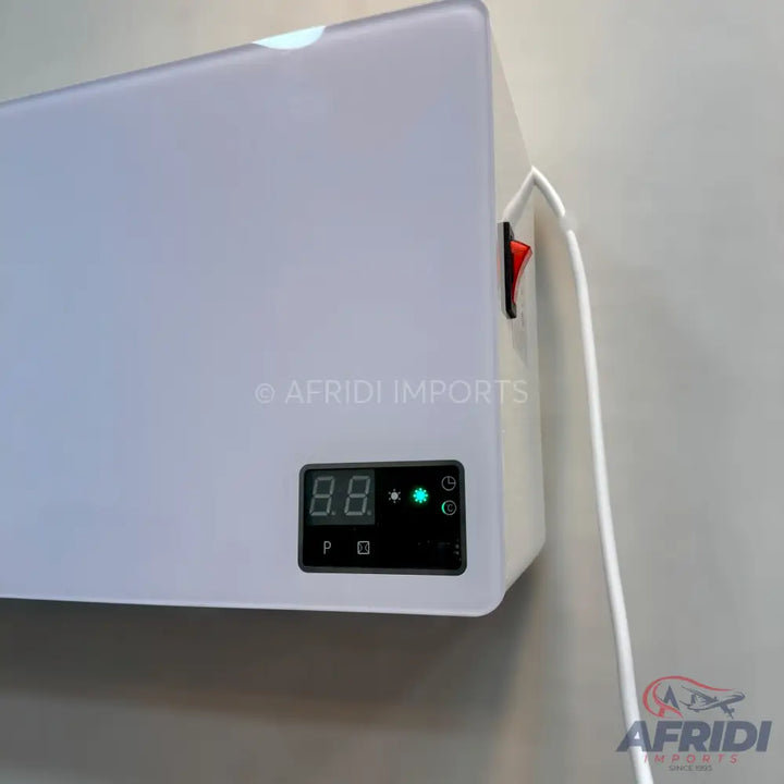 White wall-mounted water heater with a digital display and an external red power switch.