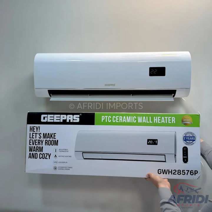 A white wall-mounted PTC ceramic heater with a digital display.