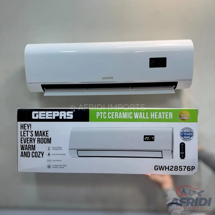 A white wall-mounted PTC ceramic heater with a digital display and remote control.