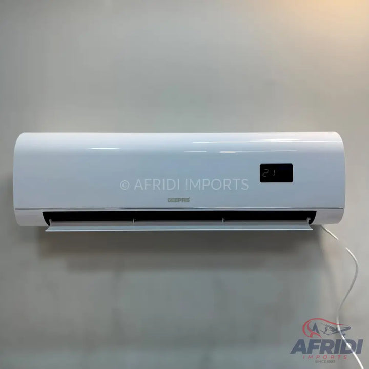 White wall-mounted air conditioner with a digital display showing ’21’’.