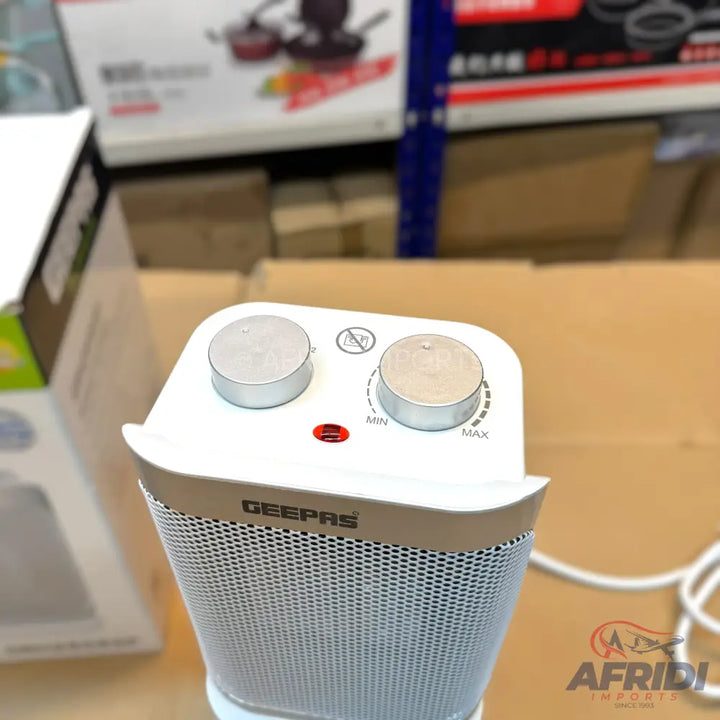 White and silver GEEPAS electric space heater with two control knobs.