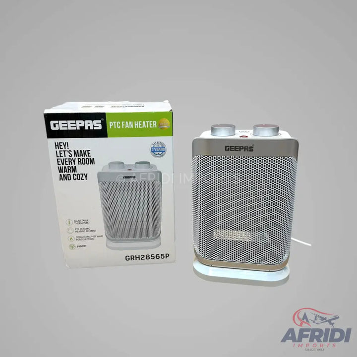 A white and gray electric fan heater with two control knobs on top.
