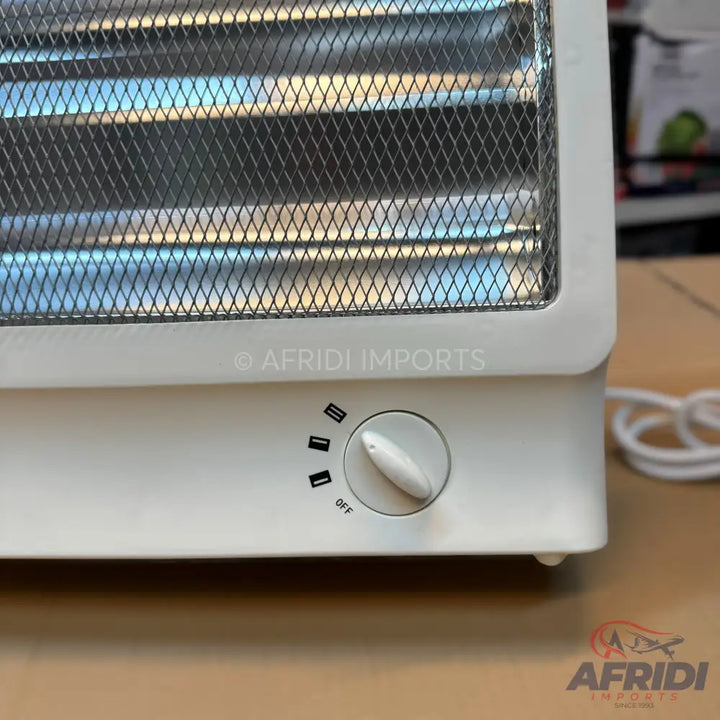 White electric space heater with a mesh grill and a rotary dial for power settings.
