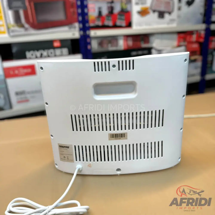 White electric air cooler with a power cord.