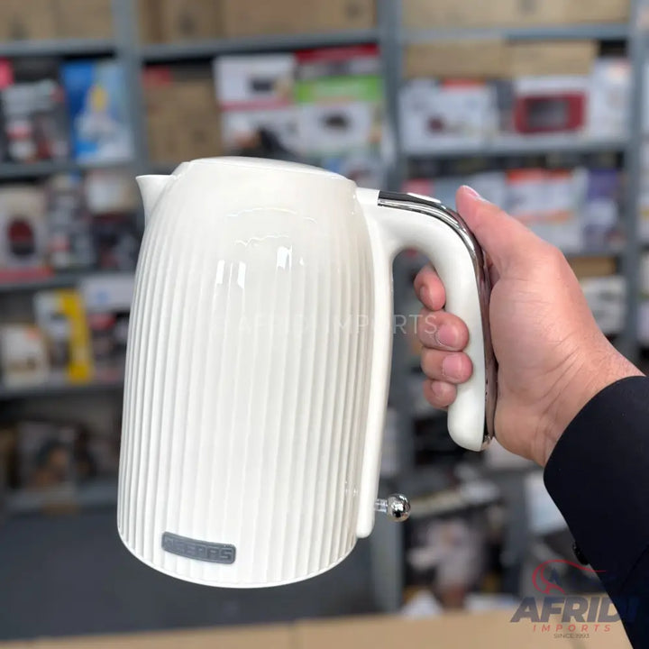 Cream-colored electric kettle with a ribbed design and chrome accents.