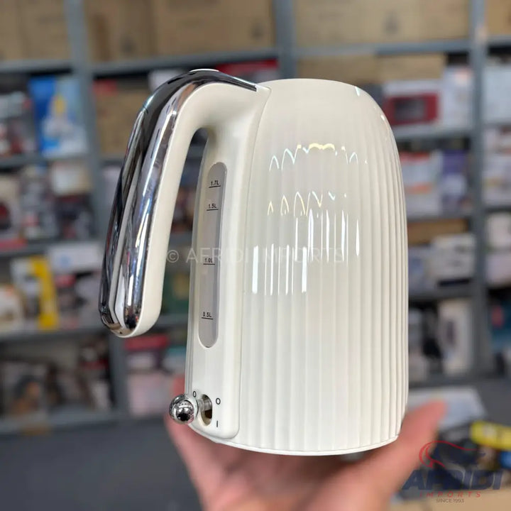 Cream-colored electric kettle with a chrome handle and water level indicator.
