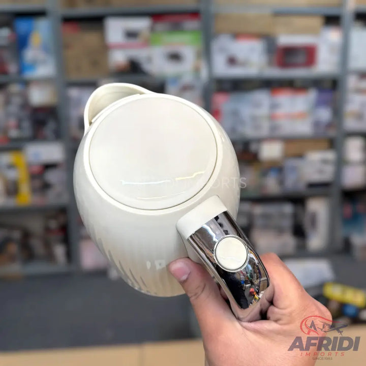 White electric kettle with a chrome handle.