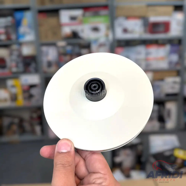 White grinding wheel with a black center hub.