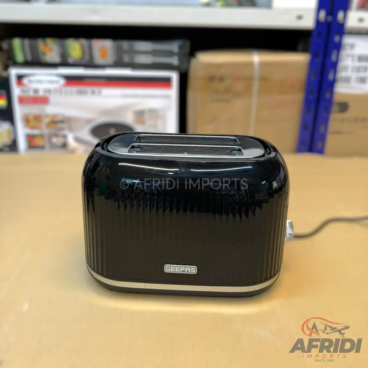 Black two-slice toaster with ribbed sides and chrome accents