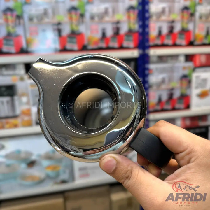 A shiny, chrome-plated, handheld food chopper with a black handle.