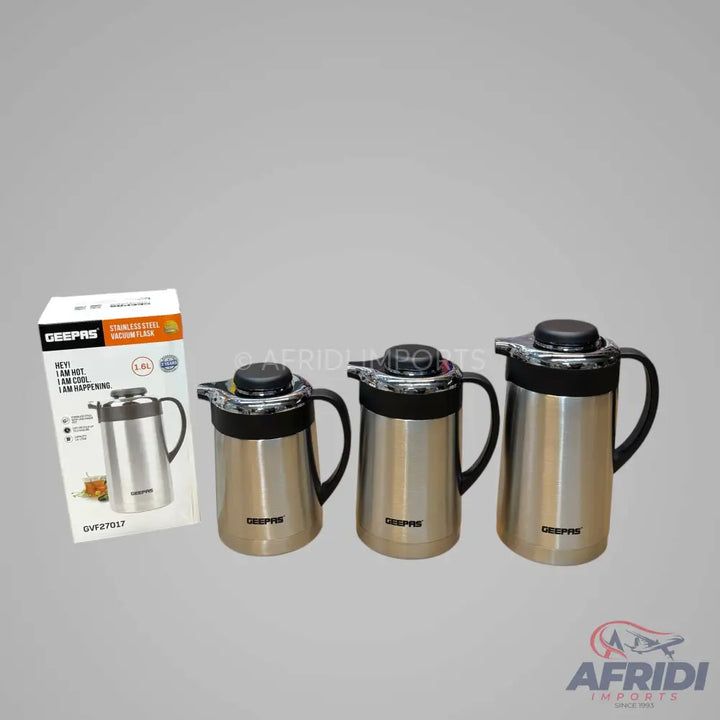 Set of three stainless steel vacuum flasks with black handles.