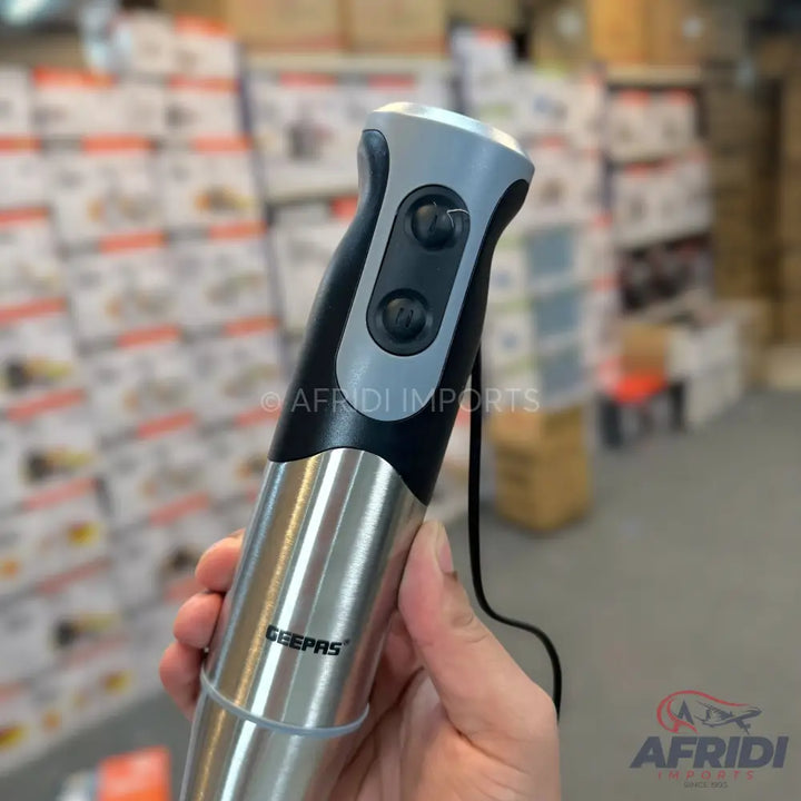 A black and silver handheld immersion blender with two control buttons.