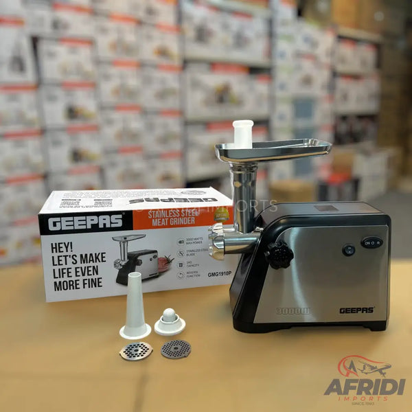 Stainless steel meat grinder with various attachments.