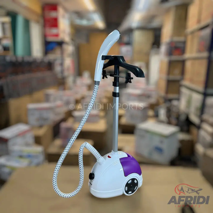 White and purple garment steamer with a hose and a clothes hanger attachment.