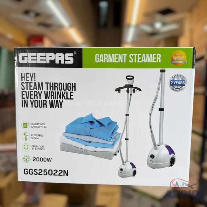 A white and purple standing garment steamer with a hose and hanger attachment.