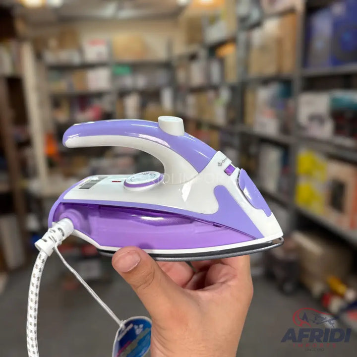 A purple and white steam iron with a textured power cord.