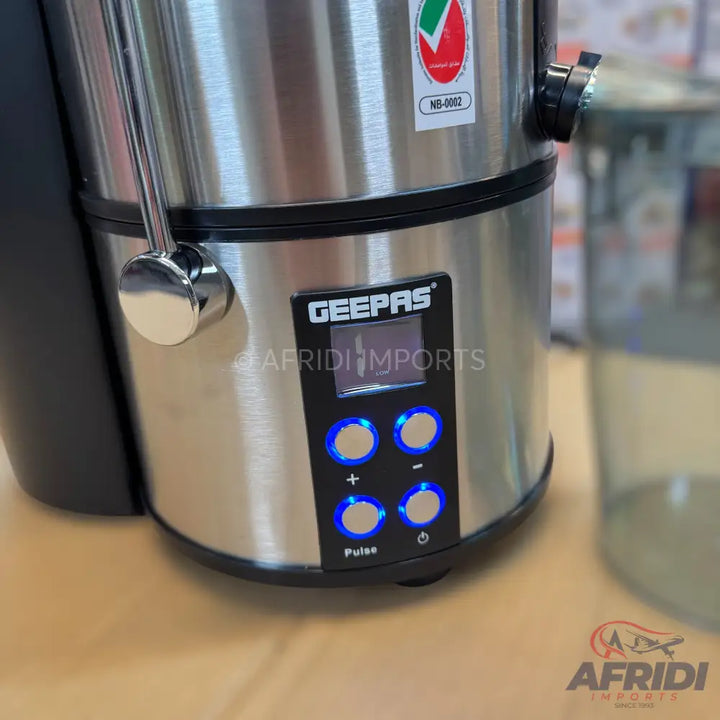 Stainless steel juicer with a digital display and illuminated control buttons.