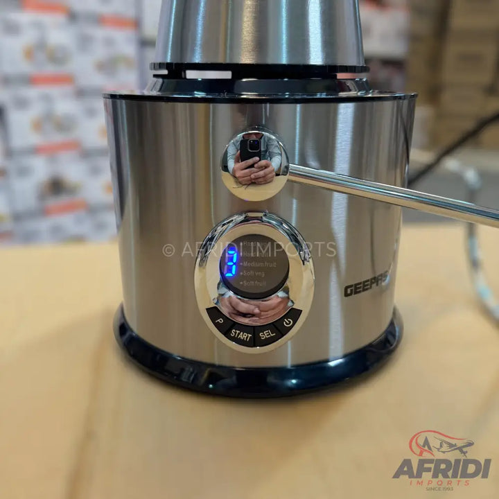 A stainless steel kitchen appliance with a digital display and control buttons.