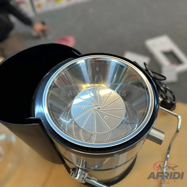 Stainless steel citrus juicer with a black base.