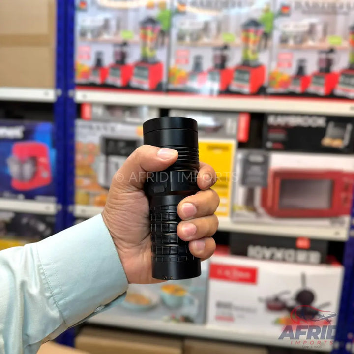 A black, cylindrical flashlight with a textured grip.