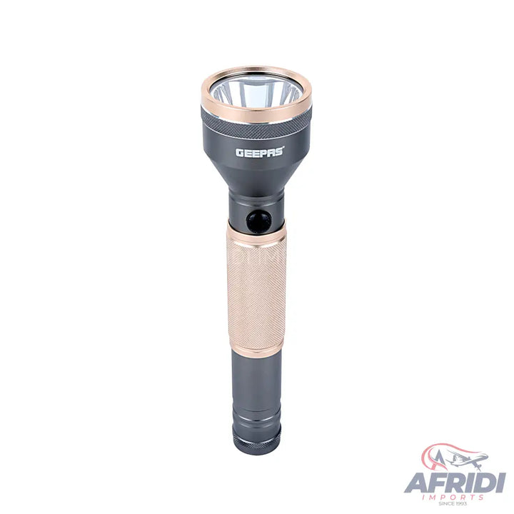 A dark gray and rose gold flashlight with a textured grip.