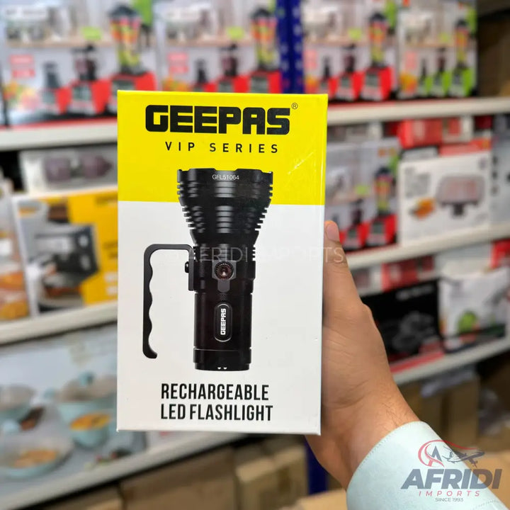 Black rechargeable LED flashlight in a white and yellow box.