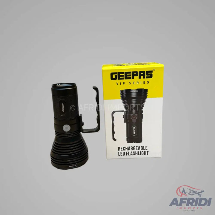 Black rechargeable LED flashlight with a side handle, next to its yellow and white packaging.