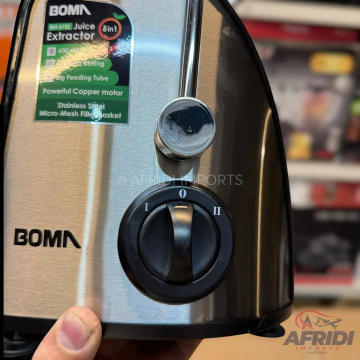 Stainless steel juice extractor with a powerful copper motor and two-speed settings.