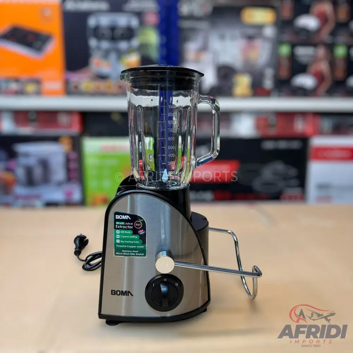 A silver and black blender and juice extractor with a glass pitcher.