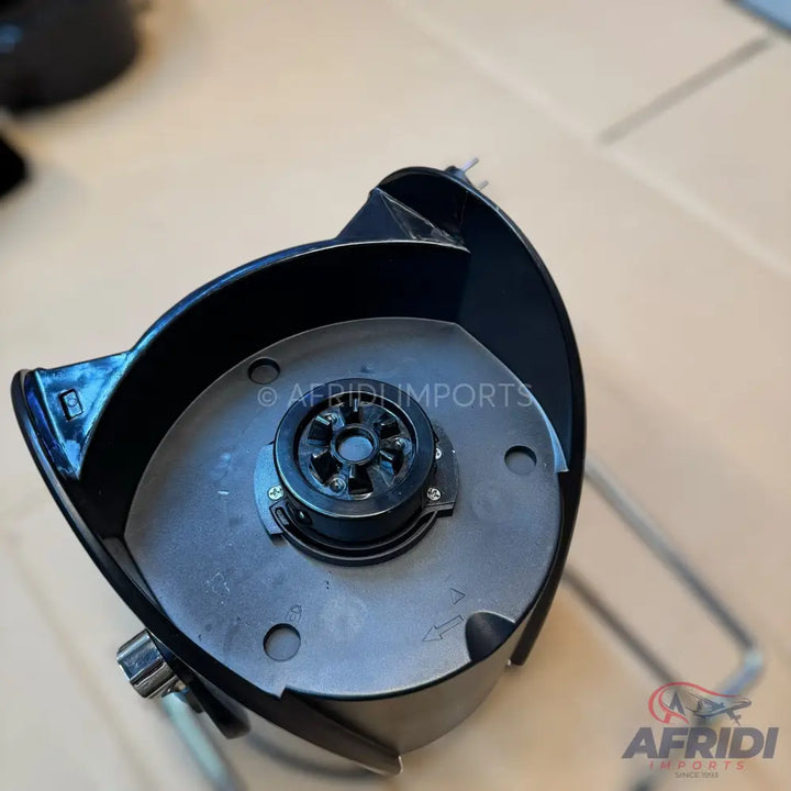 Black blender base with a multi-pronged drive socket.