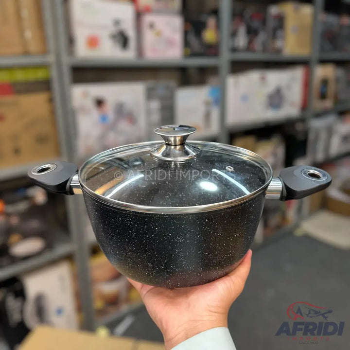 Black speckled non-stick cooking pot with a glass lid and two side handles.