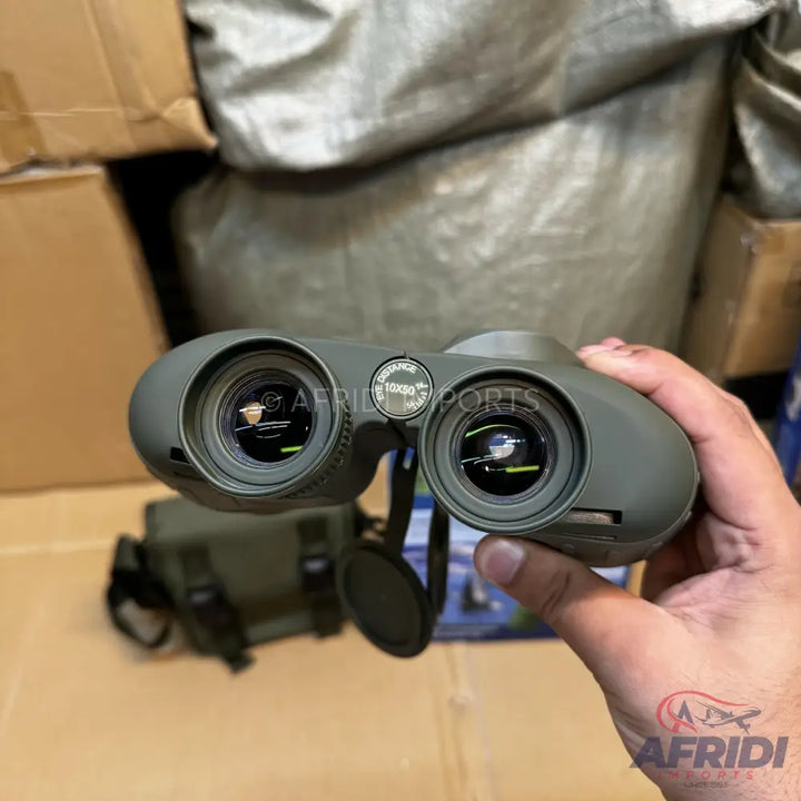 Olive green binoculars with adjustable focus and lens caps.