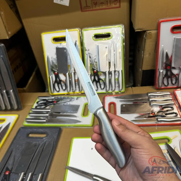 A stainless steel boning knife with a silver handle.