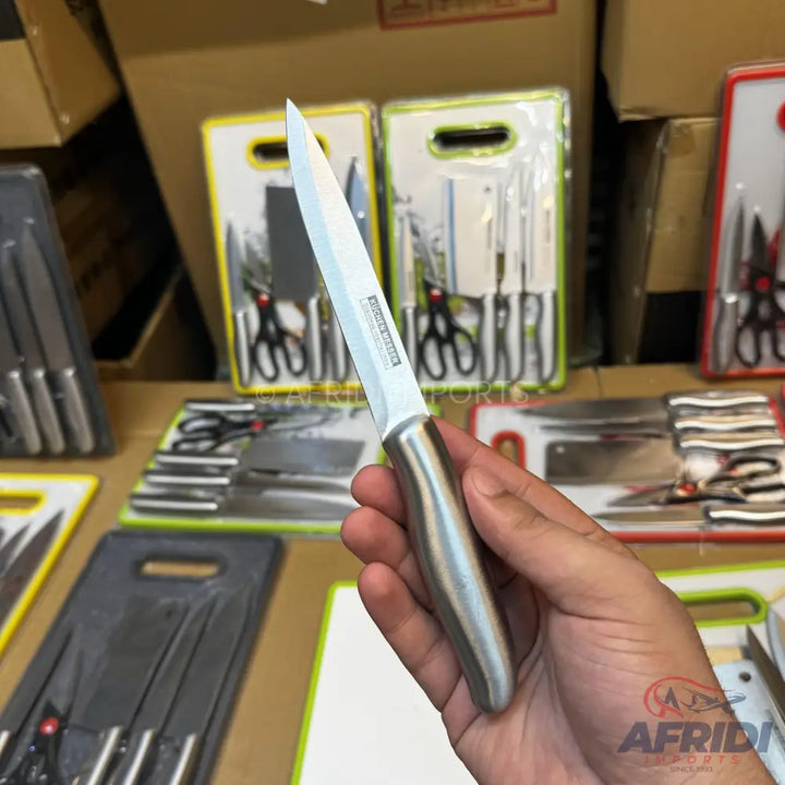 Stainless steel paring knife with a full tang and brushed metal handle.