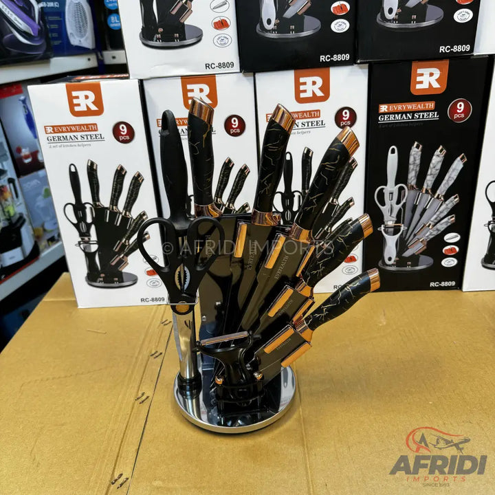 A black and gold 9-piece knife set with a unique hand-shaped block.