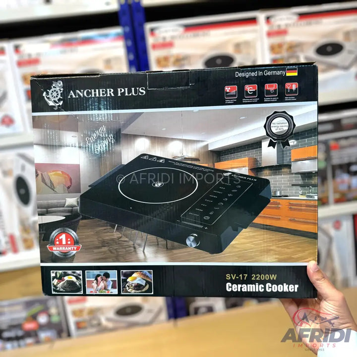 Black ceramic cooker with a single burner and touch controls.