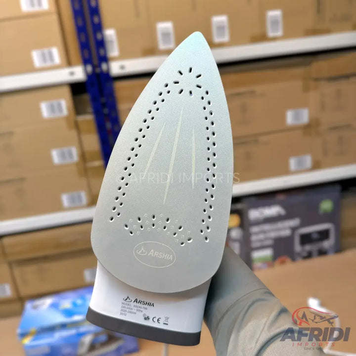 White steam iron with a perforated soleplate.