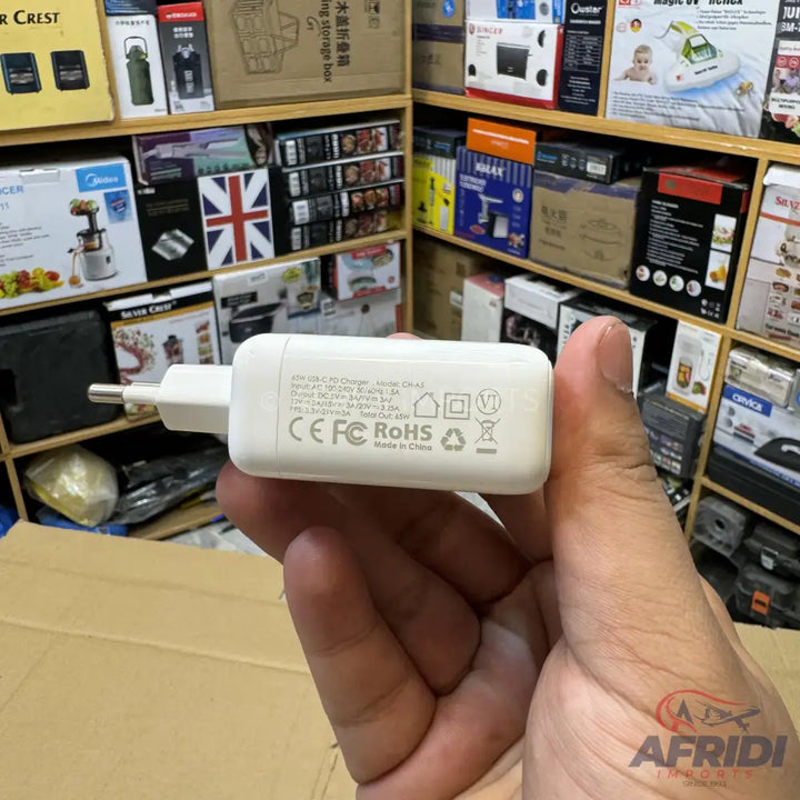 White USB-A wall charger with two prongs.