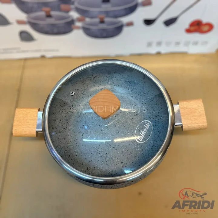 A gray speckled cooking pot with two wooden handles and a glass lid with a wooden knob.